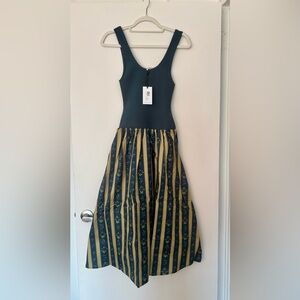 Brand new we wore what dress in size M. It’s stunning in person.